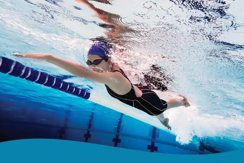 Girl underwater competing swimming